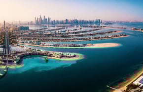 a cityscape of a city with a large body of water