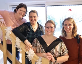 a group of people standing on a staircase case