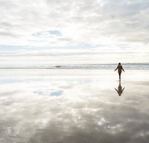 a person walking on a beach with your soul