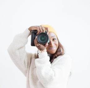 Portrait of Shade holding a camera