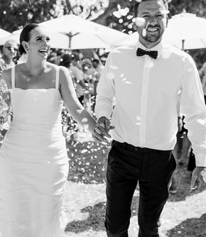 Newlyweds walk down the aisle at a Noosa beach wedding ceremony