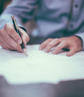Forensic Services (someone signing a legal document)