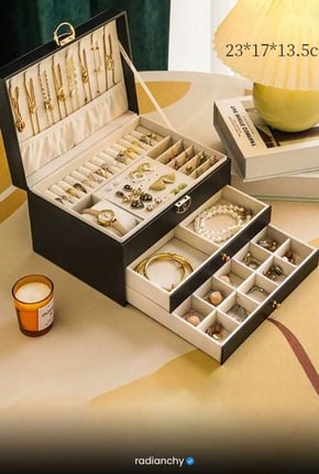 a jewelry box with a candle and a candle