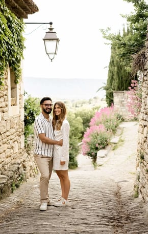 Smiling couple in cobblestone village — South of France wedding photography price