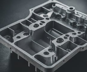 a metal box with a metal structure and a black and white photo