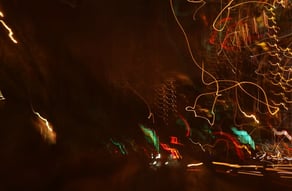 a blurry photo of a city street at night