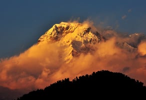 a mountain with a mountain in the background