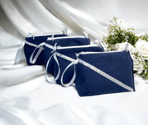 three bridesmaild bags of blue and white with flowers