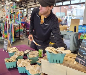 Your local Mushroom Cultivator, Jordan Clark, at Independence Uptown Farmers Market.