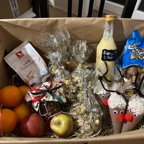 a box of fruit and nuts in a box as christmas presents