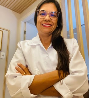 a woman in a white shirt and glasses