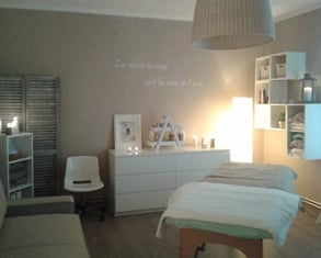 a room with a bed, a couch, and a chair