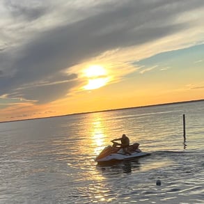 a man riding a jet ski in the water