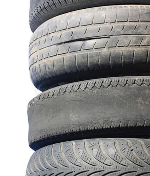 Worn out car tyres in a tire repair shop Nigeria