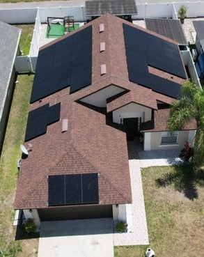 a house with solar panels installed on a roof