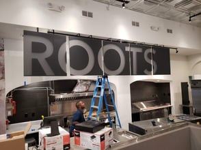 Multi-Panel Second Surface Ceiling Hanging Sign for Roots