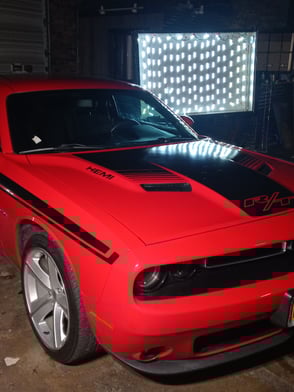 Custom Hood Graphics for Dodge Charger RT. 3M 2080 Wrap Vinyl installed by Jackson Crane taken in front of a light box