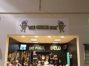 3 dimensional logo sign for a sneaker store in the mall