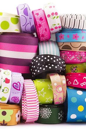 mixed printed grosgrain ribbons in various designs and colors