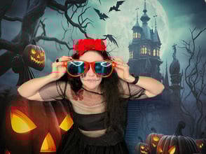Carly co founder of SweetAz Co. posing in the photo booth for a halloween event in Redlands