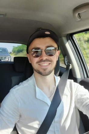 William, founder of Notionbase, driving a car