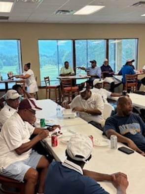 SAAG Inc. image of a group of people listening