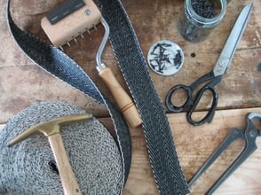 Upholstery tools, featuring scissors, webbing, pliers, nails and webbing stretcher