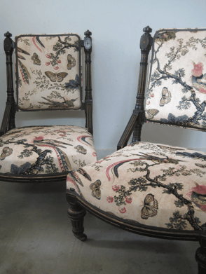 Ebonised antique nursing chairs with new traditional upholstery, and pink velvet chintz fabric with birds and butterflies