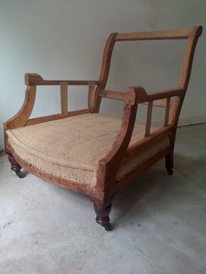 Antique armchair with new traditionally upholstered seat