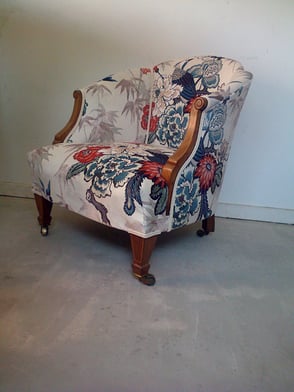 Edwardian armchair with new upholstery and a white velvet fabric, featuring a tropical bird and floral design