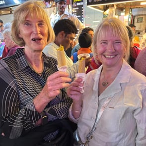 beautiful ladies enjoying a home-made ice-cream called Kulfi on a Food Walk