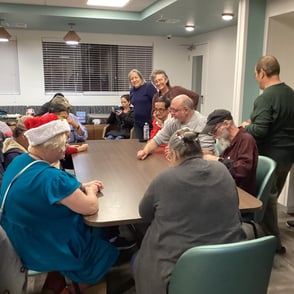 Group of people sitting around rectangle table
