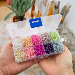 mixed color pearl beaded hearts in plastic storage box