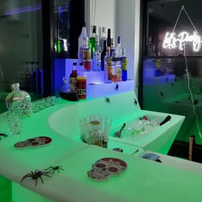 Glow corner bar setup with let's party neon in the backdround at hire event in Redlands.