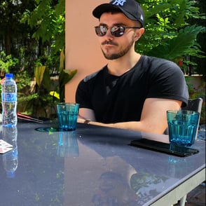 William, founder of Notionbase, sitting at a table