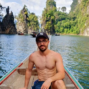 William, founder of Notionbase, posing in a boat