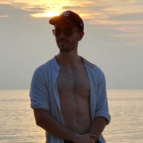 William, founder of Notionbase, posing on the beach