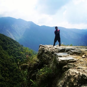 William, founder of Notionbase, standing on a cliff