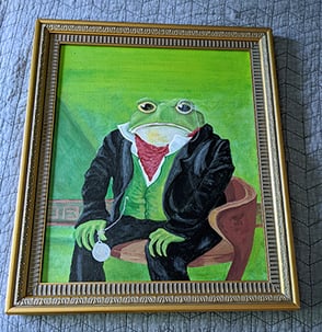 Repainted repurposed canvas and frame. Painting of a toad in a suit sitting on a chair.