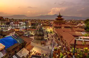 a cityscape of a city with a lot of buildings and temples