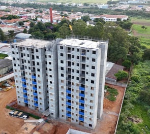 a tall building with a crane in the middle of it
