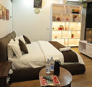 Premium Room at Hotel Kuber Murthal offering stylish interiors and cozy ambiance.