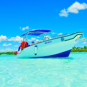 a boat in the water with a boat in the background