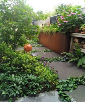 A stone path with cortensteel planter