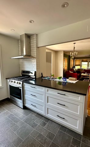 a kitchen with a stove top oven and a stove top