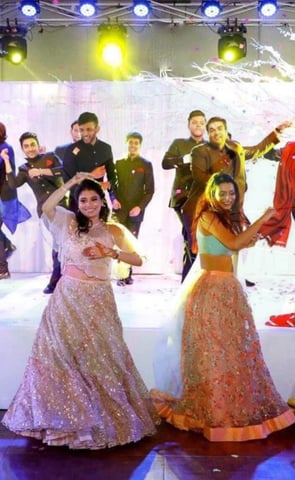 guests are enjoying group performance in a wedding ceremony