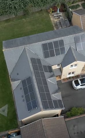 a house with solar panels installed on a roof