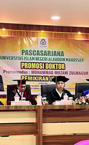 a group of people sitting at a table with a banner on it