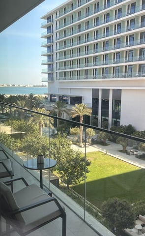 a balcony with a view of a large building
