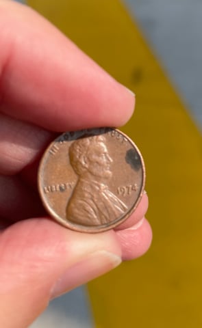 a person holding a penny penny penny penny penny penny penny penny penny penny penny penny